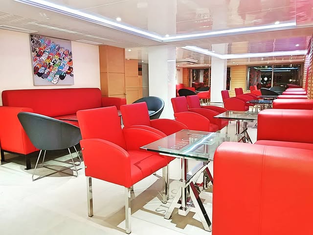 Red velvet lounge with glass tables