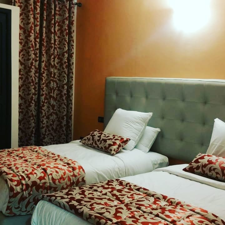 Twin room dressed in Moroccan linens