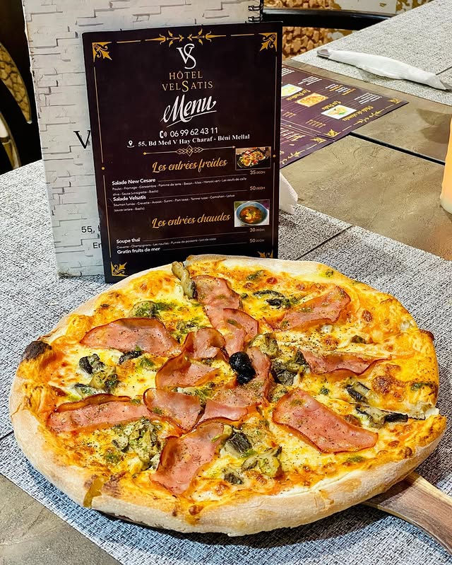 Wood-fired pizza with the Velsatis menu